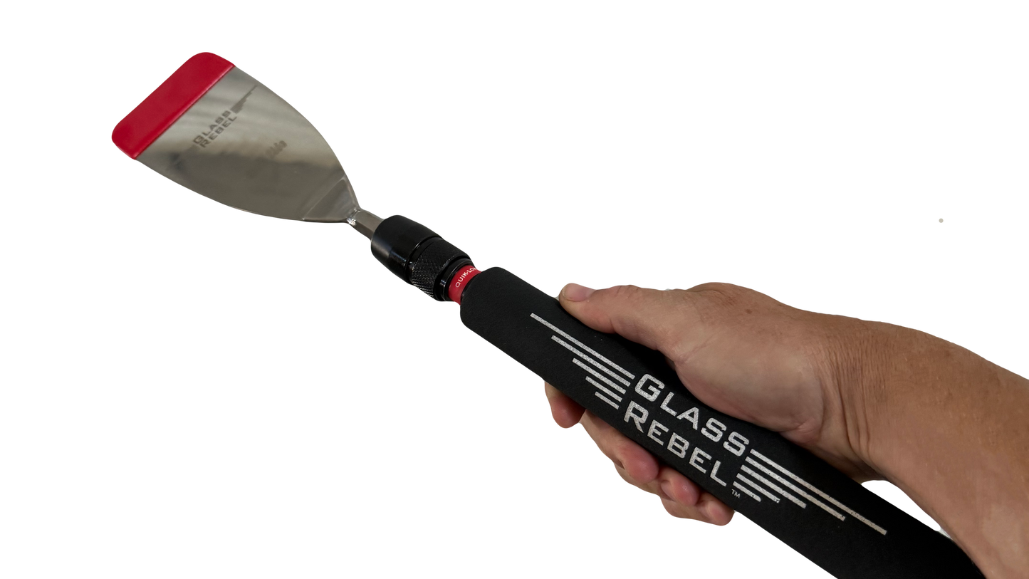The Glass Rebel Blade Handle in hand—manual quick-connect control for tight, delicate auto glass cuts.