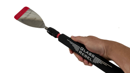 The Glass Rebel Blade Handle in hand—manual quick-connect control for tight, delicate auto glass cuts.